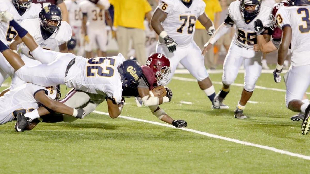 Picayune running back Josh Littles is brought to the ground by Gautier linebacker A.J. Jordan on Friday.