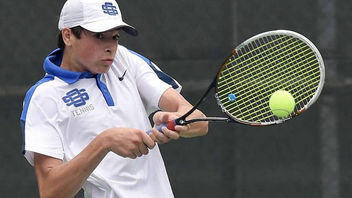 Ocean Springs' William Evans hits a backhand against Madison Central on Monday, May 9, 2016, at the MHSAA Class 5A and 6A State Tennis Team Championships at Parham Bridges Tennis Center in Jackson. OSHS and Madison face off again Monday.