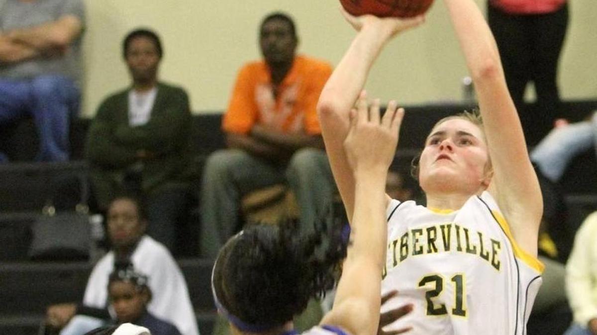 D'Iberville's Casey Ferguson puts up a shot over St. Martin's Daphane White during the second quarter of their game at D'Iberville on Jan. 8, 2016. Ferguson recently committed to South Alabama.