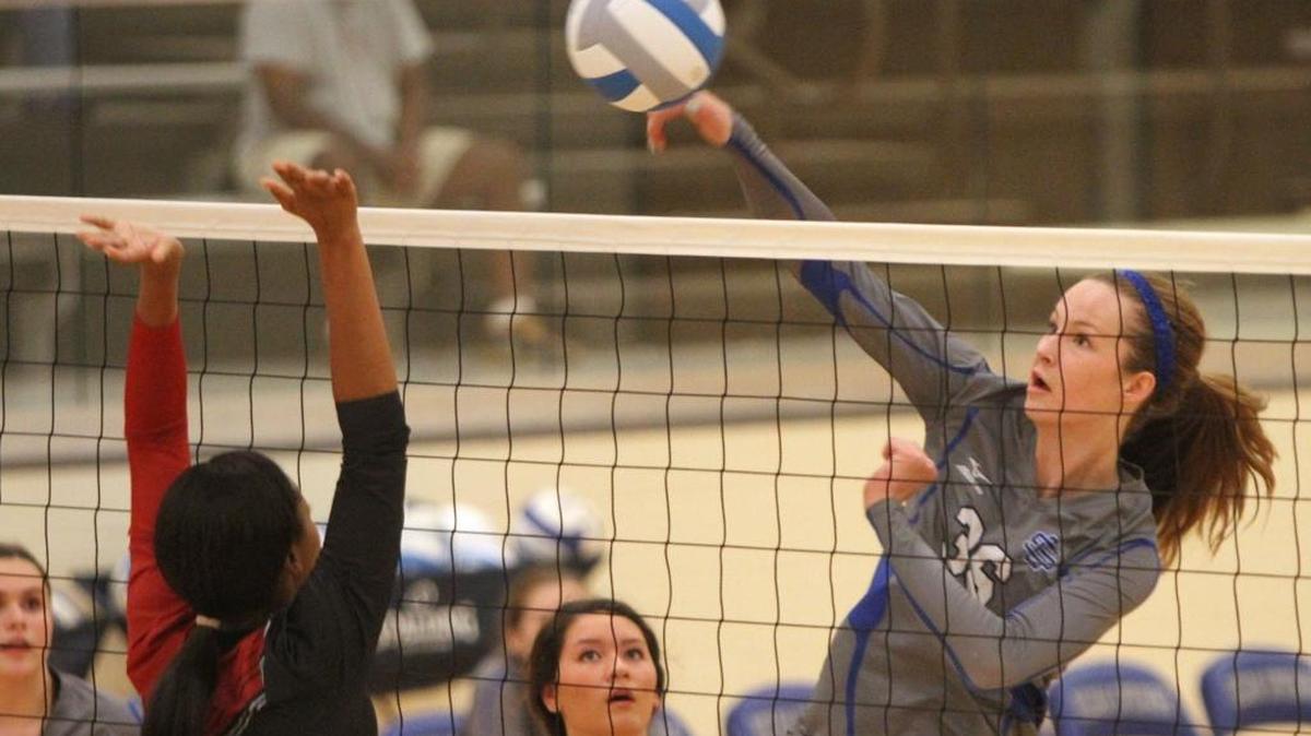 Ocean Springs' Amelia Moore hits a shot against Harrison Central during the second game of their volleyball match at Ocean Springs High School on Thursday, Aug. 25, 2016. Moore led OSHS past East Central on Tuesday.