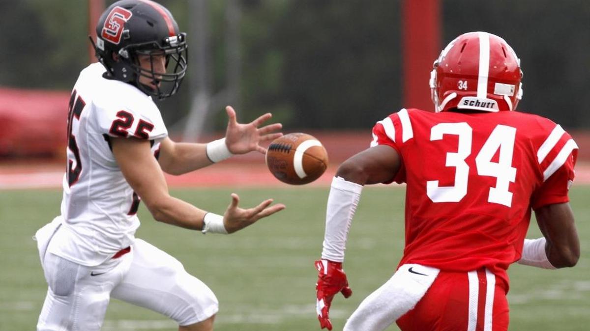 Taylor Necaise of St. Stanislaus juggles the ball as Biloxi's Asonti Hall makes sure the pass is incomplete at the Shrimp Bowl, Saturday afternoon, Aug. 19, 2017.