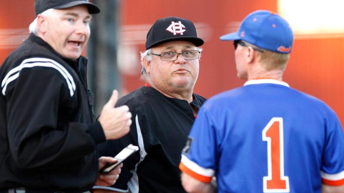Harrison Central baseball coach Pat Olmi talks with Gulfport's Jamie McMahon before the game starts, Monday, April 7, 2017. Olmi recently announced his retirement.