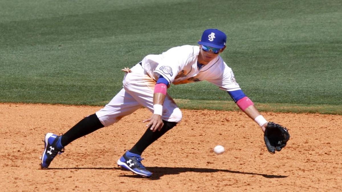 Shuckers shortstop Mauricio Dubon ranges to his left to make a diving stop of a ground ball during game between the Shuckers and Braves.