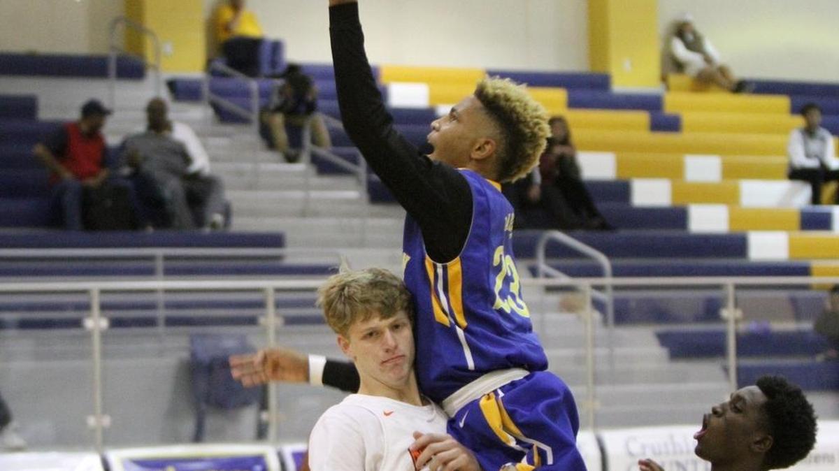 St. Martin's Cam'Ron Jones drives to the basket against McGill Toolen's Matthew McNeese fouls during the third quarter of their Joe Barlow Thanksgiving Invitational basketball tournament game on Tuesday, Nov. 22, 1016.