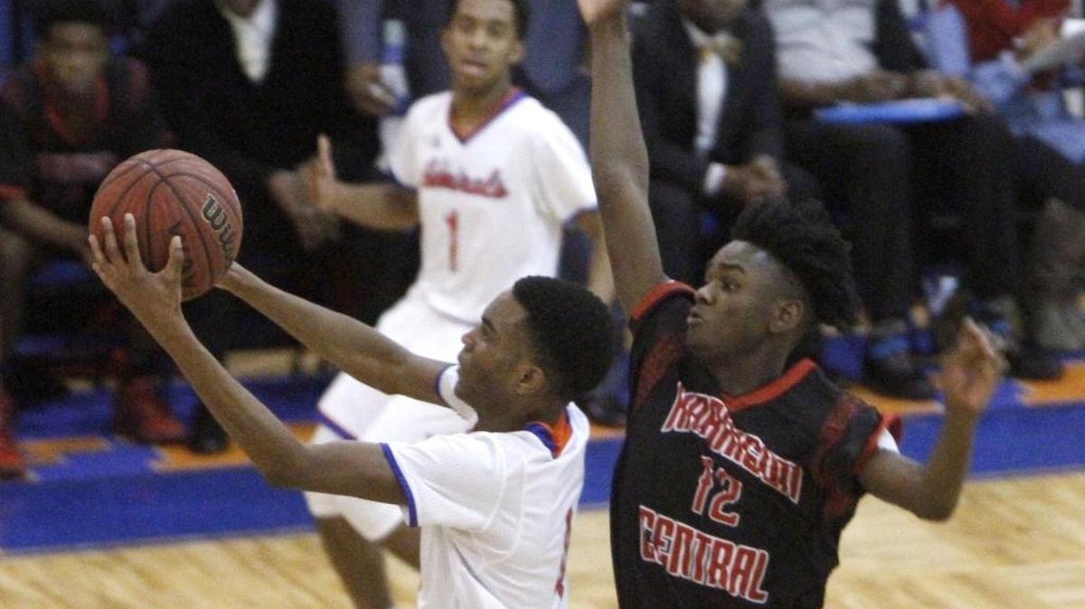 Harrison Central's Anthony Barnett tries to block the shot of Gulfport's Keevon Oney, Friday, Jan. 6, 2017. Oney helped lift Gulfport past Biloxi on Tuesday night to open the Region 8-6A Tournament at BHS.