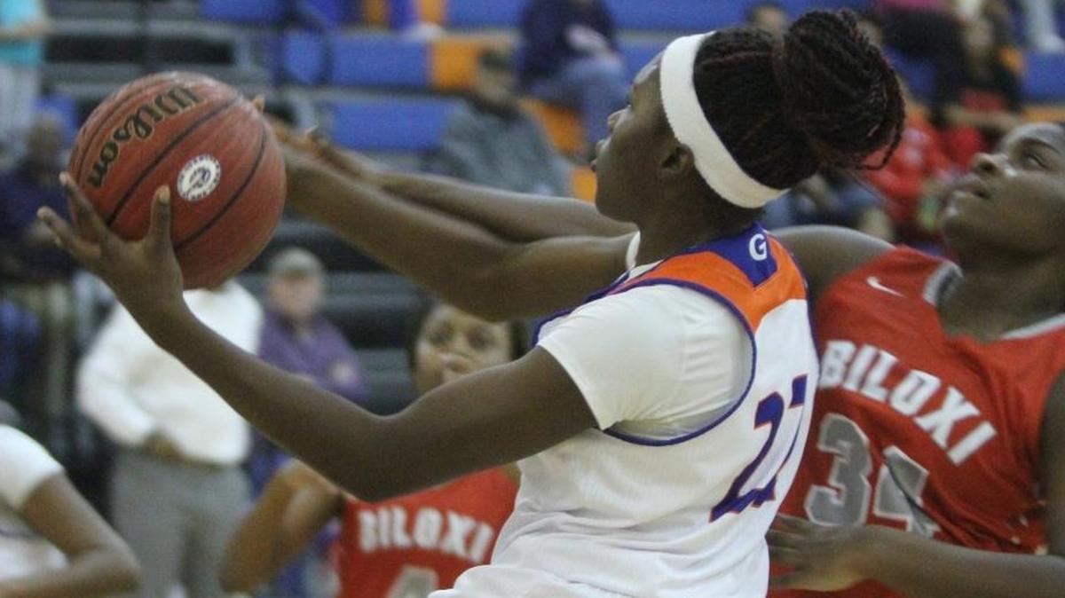 Biloxi's Sharon Williams fouls Gulfport's Whitney Johnson as she drives to the basket during the first quarter of their game at Bert Jenkins gym in Gulfport on Jan. 20.