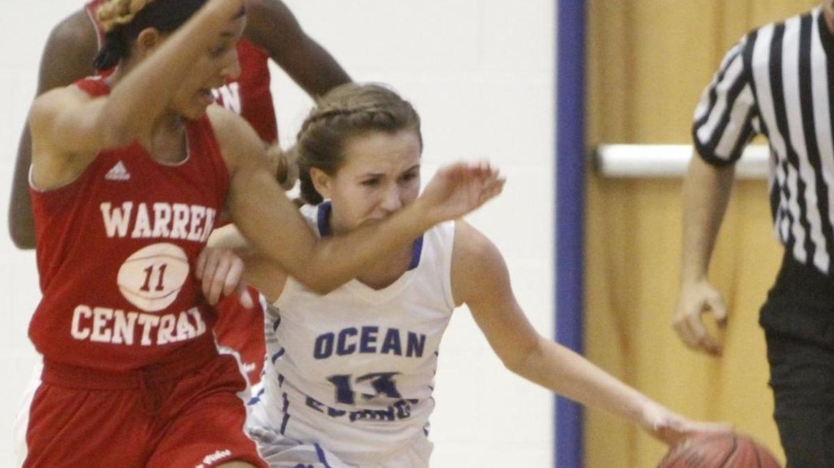 Ocean Springs' Sophia St. Amant brings the ball up court against Warren Central's Dominque Caldwell during the third quarter of their game in the Lady Admirals Thanksgiving Tournament at Bert Jenkins gym in Gulfport on Wednesday, Nov. 22, 2017.