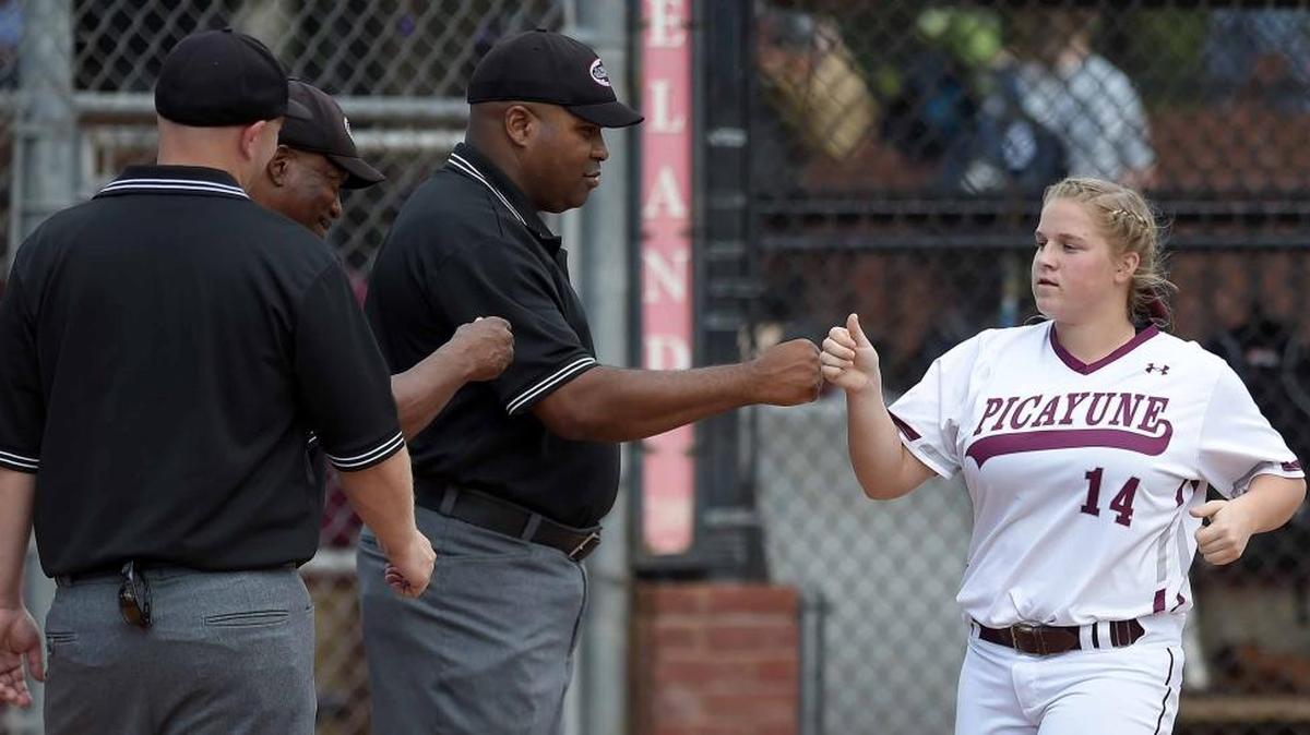 Picayune's Lexis Picou greets the umpires as she is introduced on Friday, May 12, 2017, in the MHSAA Fast-Pitch Softball State Championship at Freedom Ridge Park in Ridgeland, Miss.
