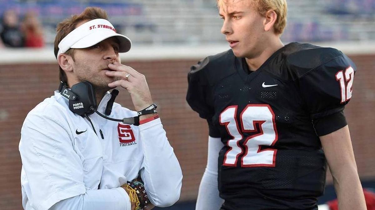 St. Stanislaus coach Bill Conides, shown talking to quarterback Myles Brennan, has accepted the same position at Denham Springs, Louisiana.