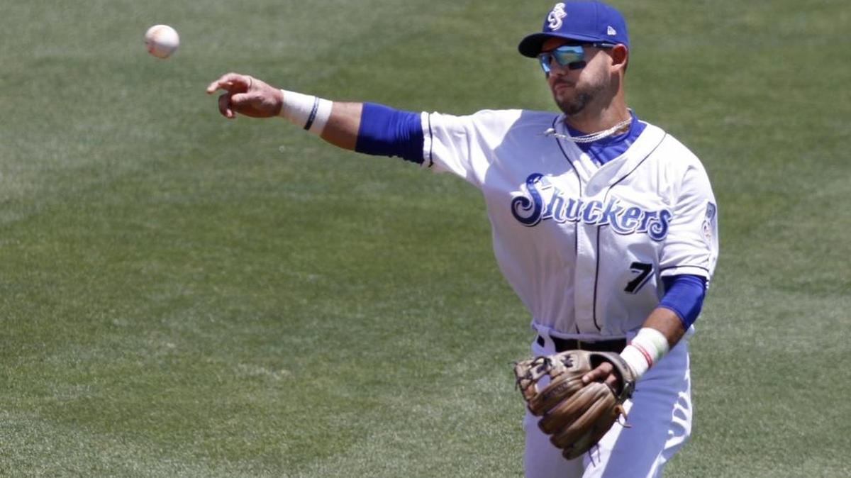 Shuckers second baseman Javier Betancourt throws to first after fielding a ground ball during game between the Shuckers and Braves.