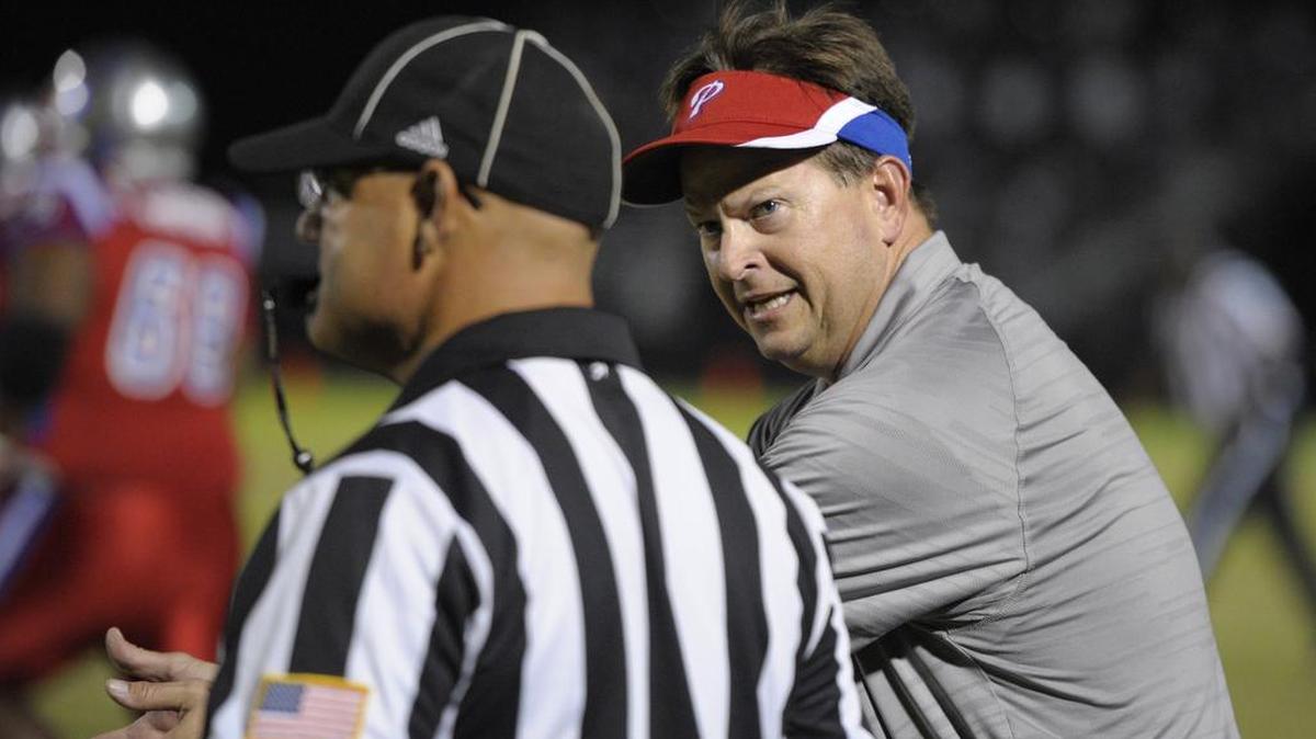 Pascagoula head coach Lewis Sims talks with an official during the first half against Gautier, Friday, Nov. 4, 2016, at Gautier High School in Gautier.