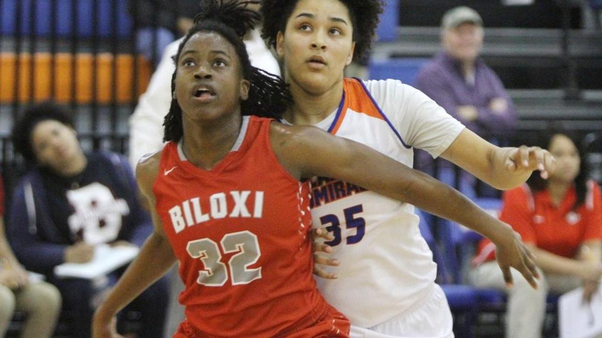 Biloxi's Anna Thigpen blocks out against Gulfport's Ayanna Lombard during the first quarter of their game at Bert Jenkins gym in Gulfport on Jan. 20, 2017.