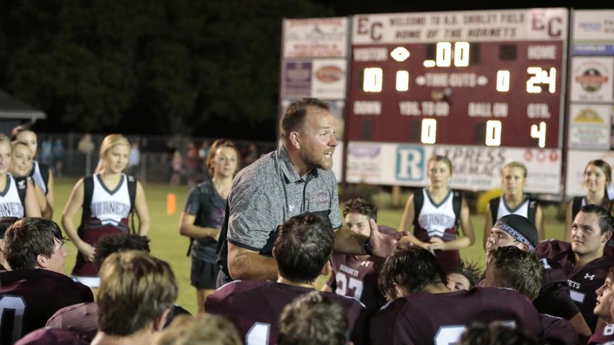 East Central head coach Seth Smith congratulates his team on a 24-10 defeat of the Biloxi Indians after their game at East Central on Aug. 25.