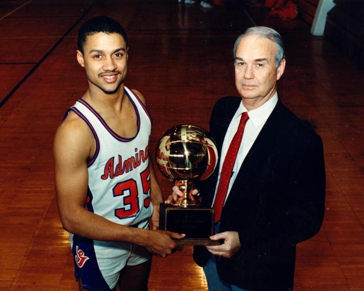 Gulfport High School boys basketball coach Bert Jenkins, right, and standout player Chris Jackson, who now goes by Mahmoud Abdul-Rauf, pose with their state championship trophy in March 1988. Abdul-Rauf is currently playing in Ice Cube’s new 3-on-3 league, the BIG3.