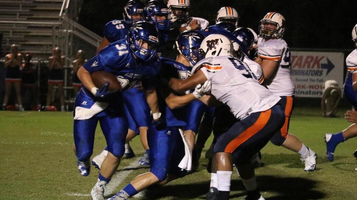 Pearl River Central Blue Devil Kalvin Briggs carries the ball for positive yardage during Friday’s game against the Wayne County War Eagles. He had a touchdown on the night.