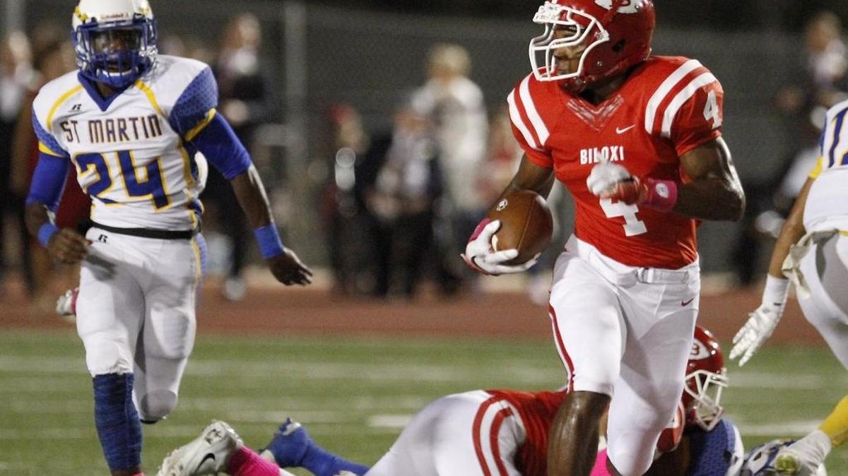 Biloxi receiver Tim Jones looks for any St. Martin defenders as he races for a 66-yard touchdown, Friday, Oct. 14, 2016, in Biloxi.