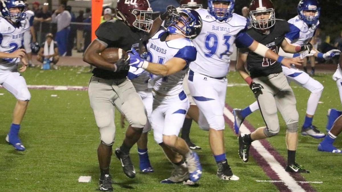 Shaun Anderson carries the ball for Picayune’s Maroon Tide against the Pearl River Central Blue Devils Friday night.