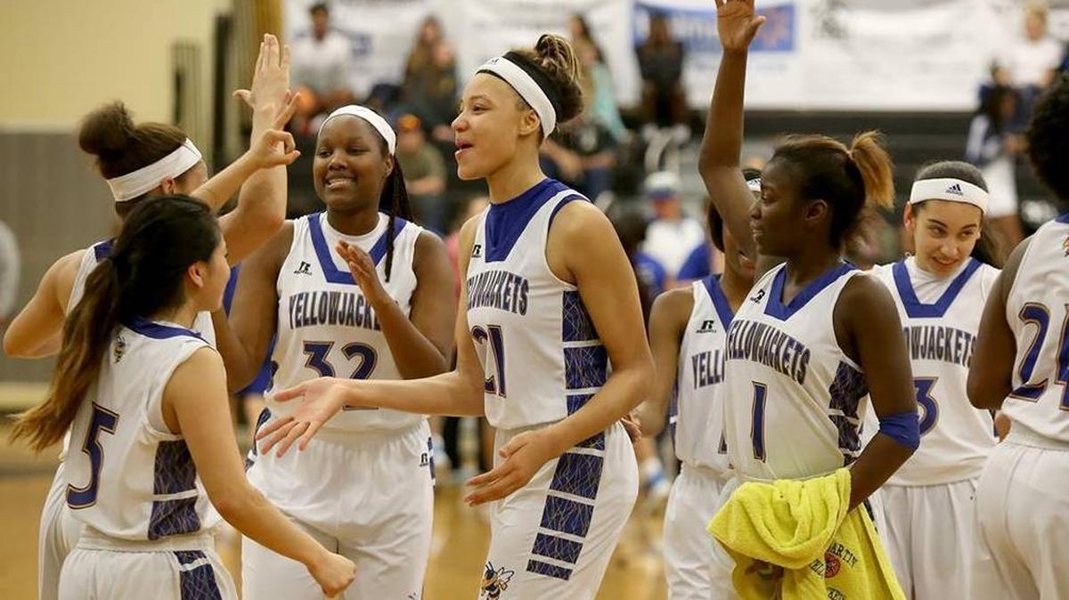 St. Martin celebrates a win over Ocean Springs on Feb. 19, 2016. Daphane White, middle, recorded a triple-double Thursday night in a win over Hattiesburg.