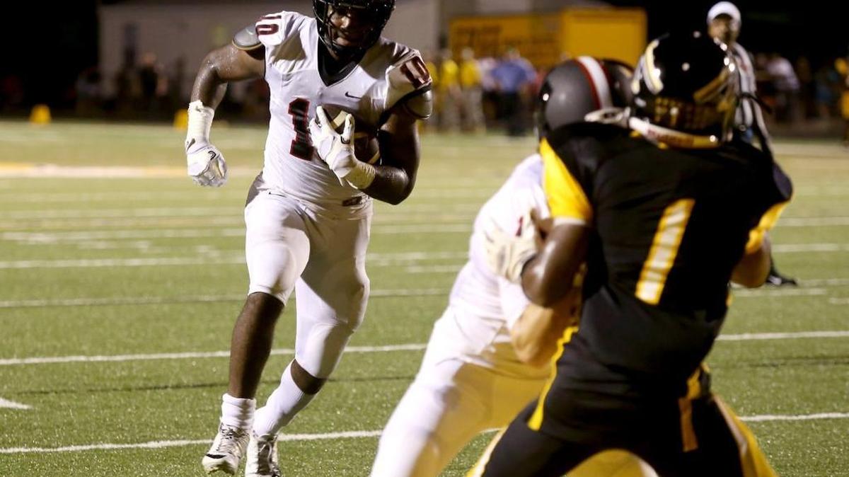 St. Stanislaus' Darius Pittman runs the ball in for a touchdown against D'Iberville on Friday, September 16, 2016. Pittman decommitted from Western Kentucky on Monday.