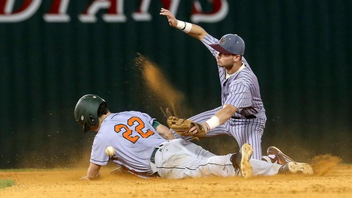 West Harrison’s Tate Parker steals second base from George County shortstop Bryson Scott during the Battle at the Beach baseball tournament on Friday, March 17, 2017, at Biloxi High.