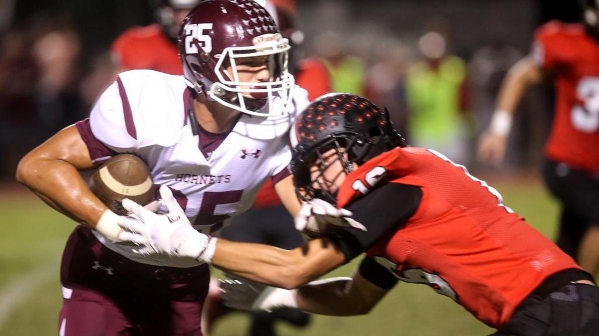 East Central's Brad Cumbest runs the ball while St. Stanislaus' Corbin Blanchard pushes him toward the sidelines on Friday, October 14, 2016, in Bay St. Louis.