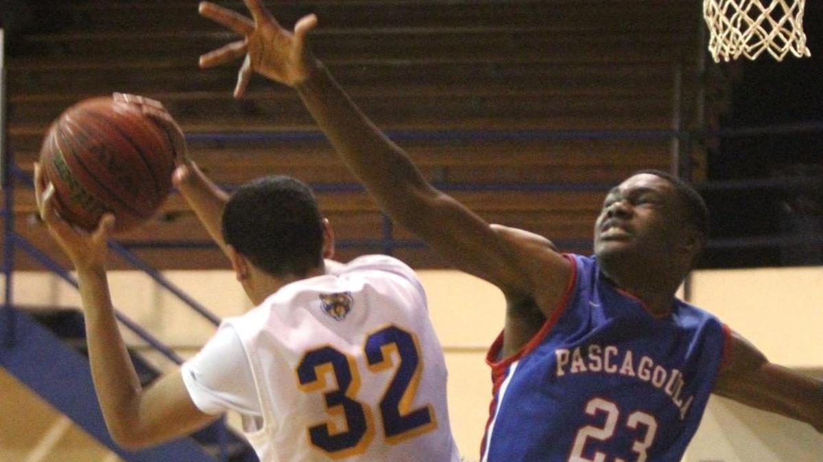 Bay's Galen Smith Jr. grabs a rebound away from Pascagoula's Zannie Montgomery during the first quarter of their game at Bay High on Tuesday, Nov. 15, 2016.
