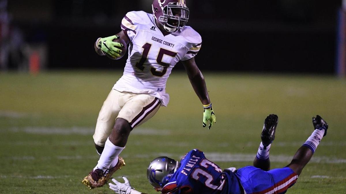 George County wide receiver Dwan Williams (15) evades Pascagoula's Adrean Johnson (23) after a pass reception during the second quarter, Friday, Sept. 9, 2016, at Pascagoula High School in Pascagoula. The Rebels routed D’Iberville 55-21 on Friday.