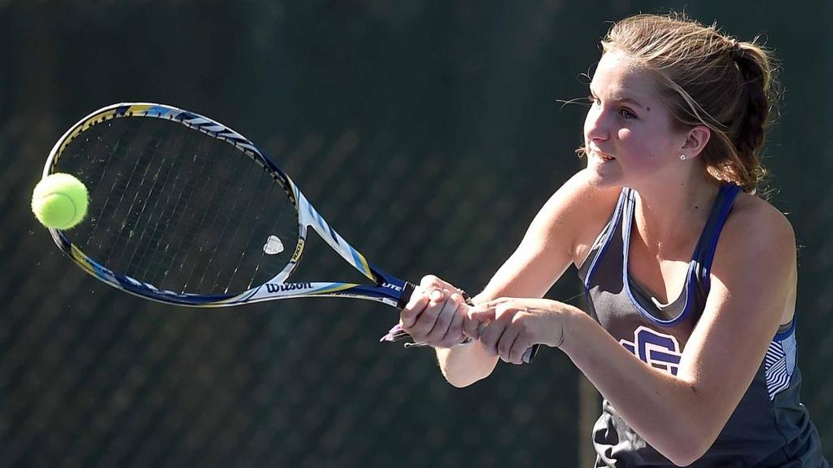 Ocean Springs' doubles team Sidney St. Amant hits a backhand against Madison Central on Monday, May 8, 2017, at the MHSAA Class 4A and 6A State Tennis Team Championship at Parham Bridges Tennis Center in Jackson, Miss.