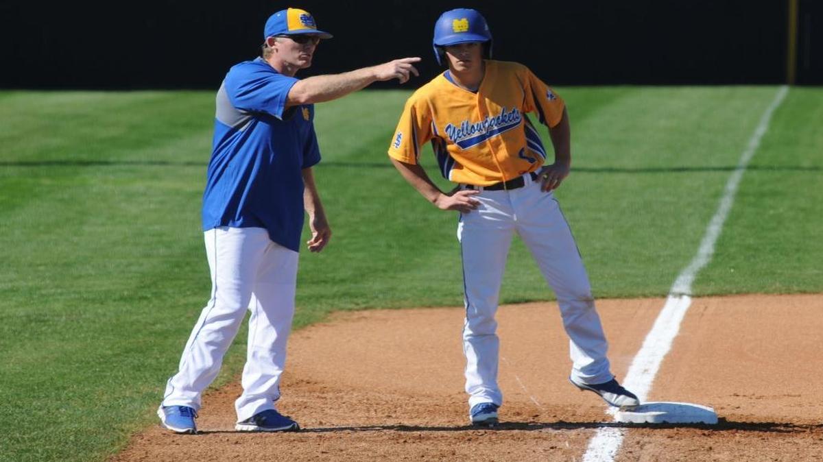 New St. Martin coach Kary Bridges, shown talking to Dakota Groue, has the Yellow Jackets off to a 10-3 start to the season. St. Martin didn’t win more than 10 games in any of the last four seasons.