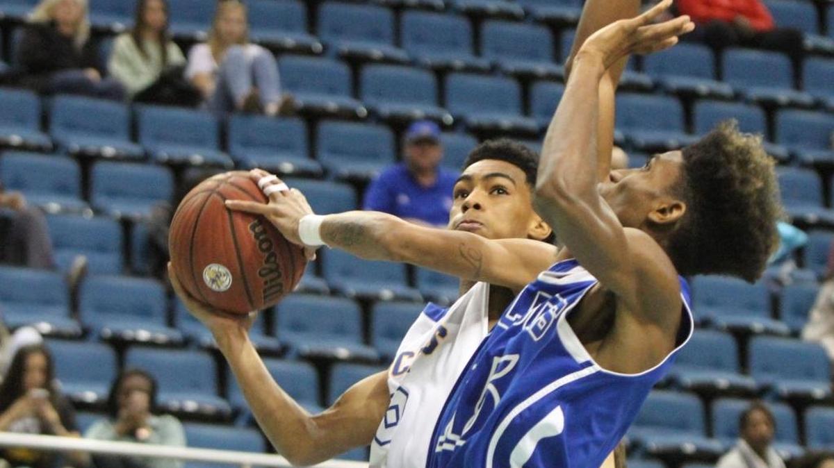 St. Martin's Trez Kennedy drives to the basket past Vancleave's Kylan Johnson during the first quarter of their Hoopsfest game at the Mississippi Coast Coliseum in Biloxi on Saturday Jan. 28, 2017. SMHS beat Gautier 40-22 on Tuesday.