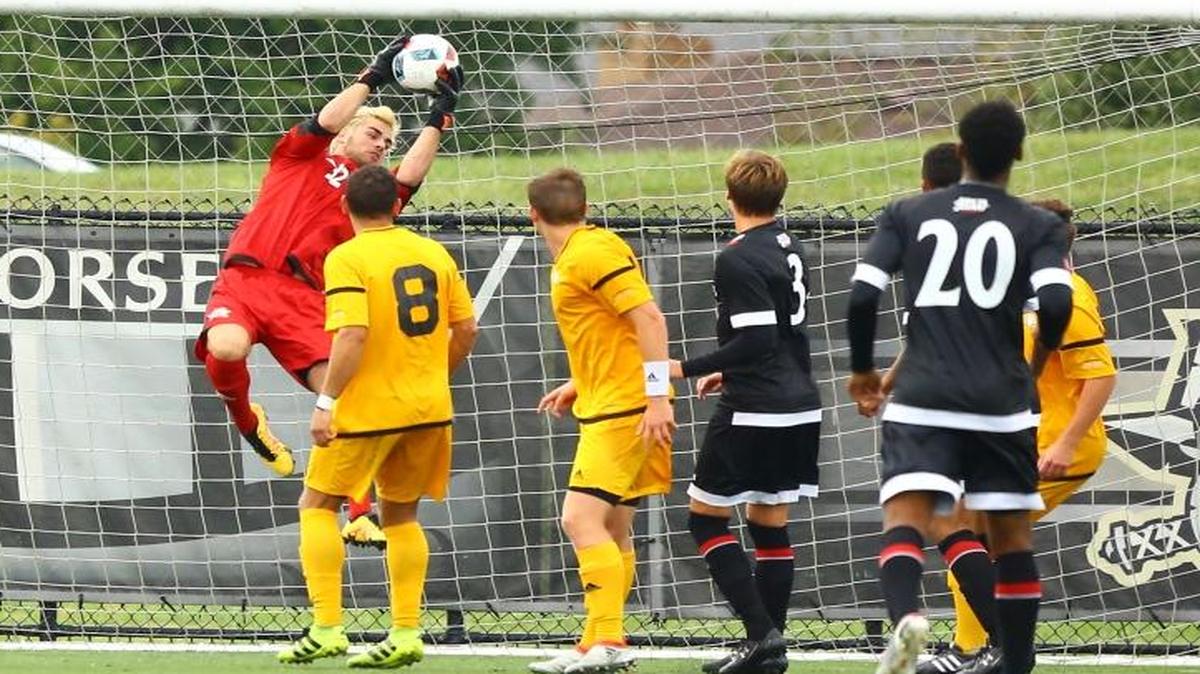 Former St. Stanislaus keeper Owen Betz makes a save in his Northern Kentucky debut against Cincinnati.