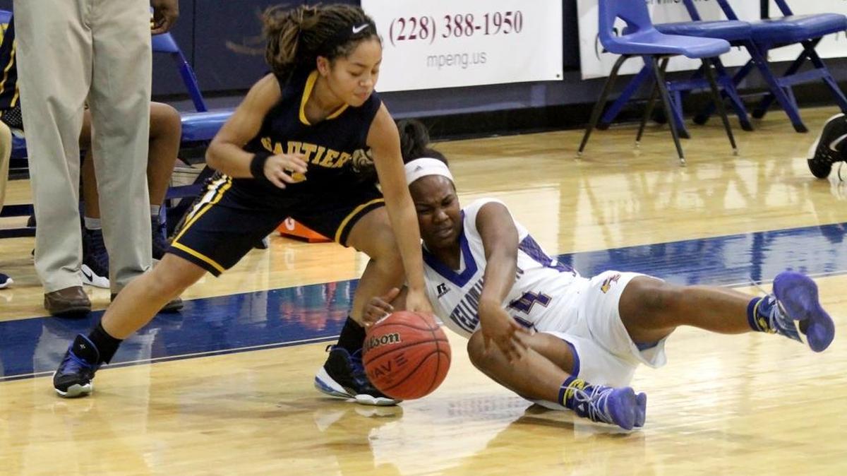 Gautier's Aliya Kline, left, and St. Martin's Mya Dixon battle for possession of a loose ball during St. Martin's Super Saturday tournament on Saturday.