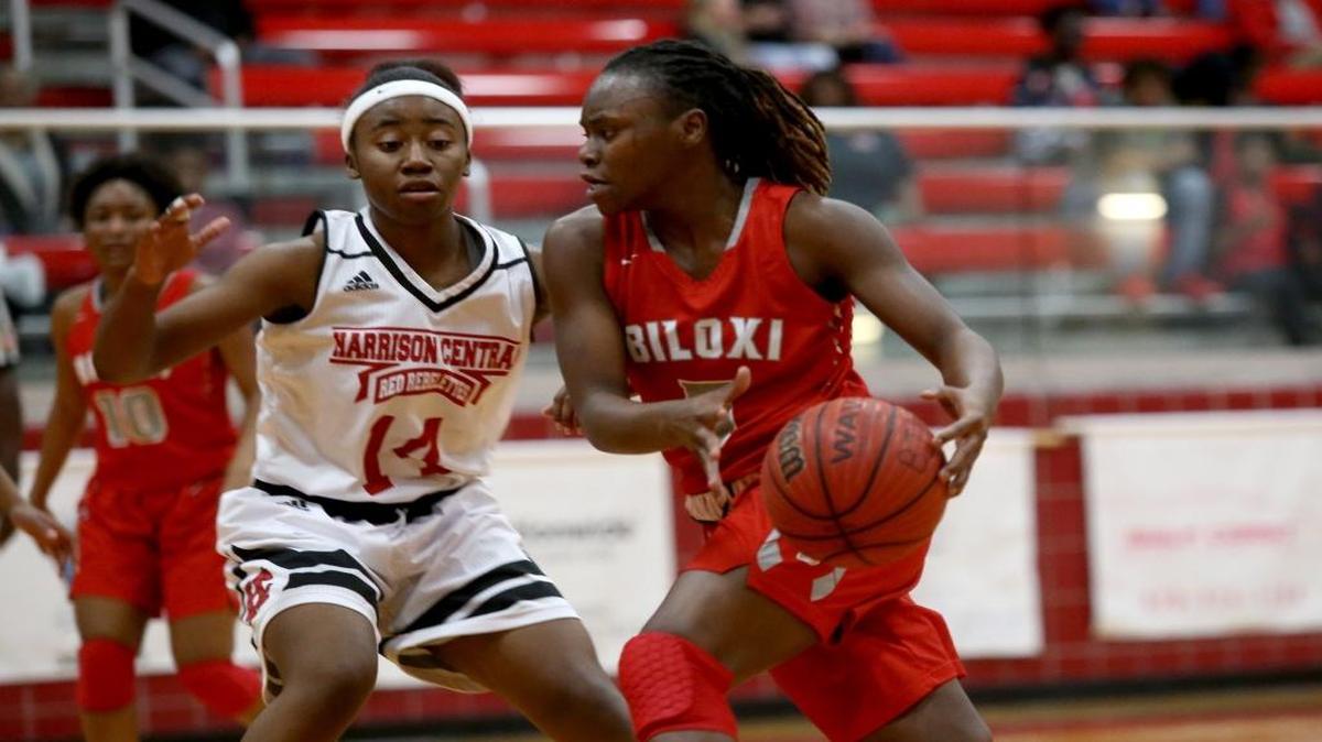 Biloxi's Breanna Riley dribbles the ball while guarded by Harrison Central's Teara Leshore during the Region 8-6A Girls Basketball Tournament final. The Lady Indians will host Pearl in a first-round playoff game Monday.