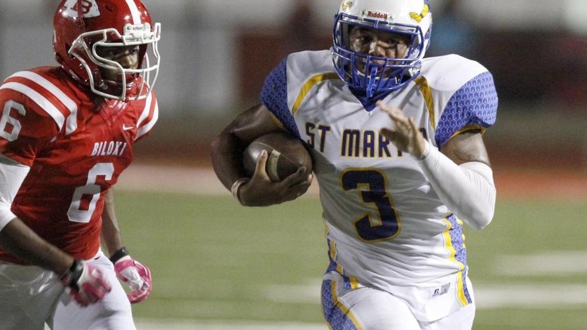 Biloxi defensive back Jiles Bradfield chases down St. Martin quarterback Wayne Overman III on Oct. 14, 2016.