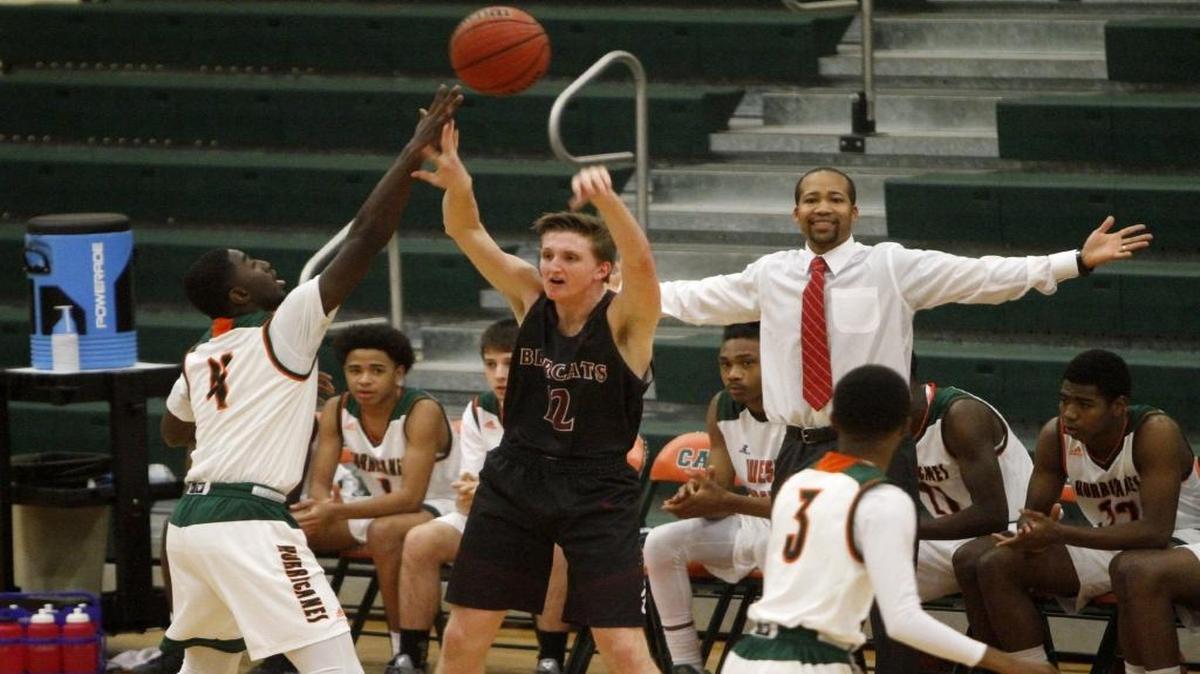 West Harrison's Quieran Gray blocks the pass of Eli Dykes of Long Beach on Tuesday at West Harrison.