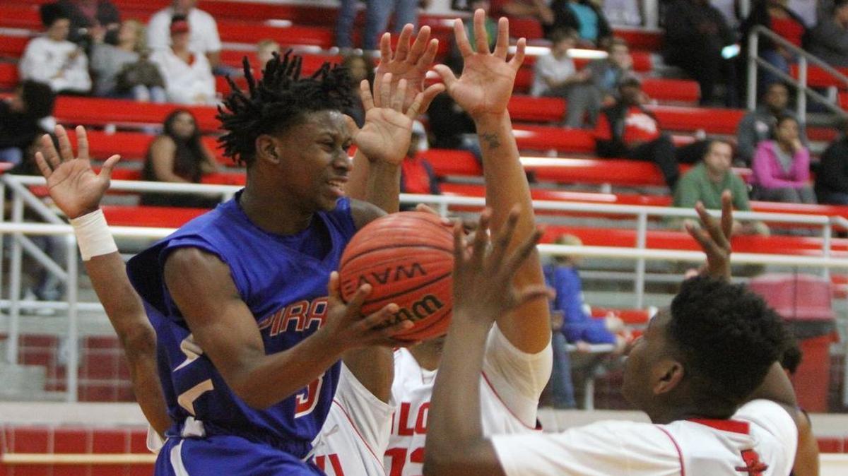Pass Christian's Tezz Green drives under the basket before loosing the ball to Biloxi's Zhi Hopson, right. Biloxi is hosting the Region 8-6A tournament. Pass Christian travels to Vancleave for the Region 8-4A tournament. Both tournaments start Tuesday.