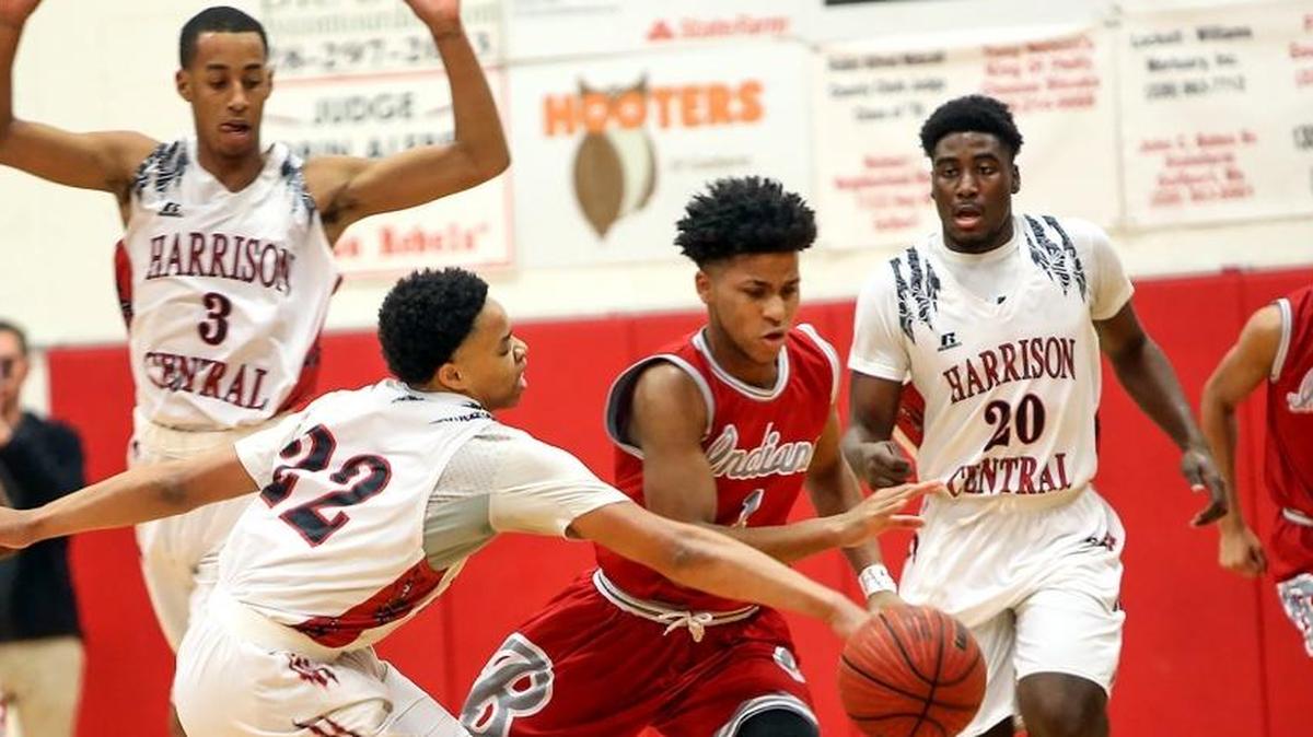 Harrison Central's Marcquz Clay knocks the ball away from Biloxi's Dillyn Neely on Friday at Harrison Central High.