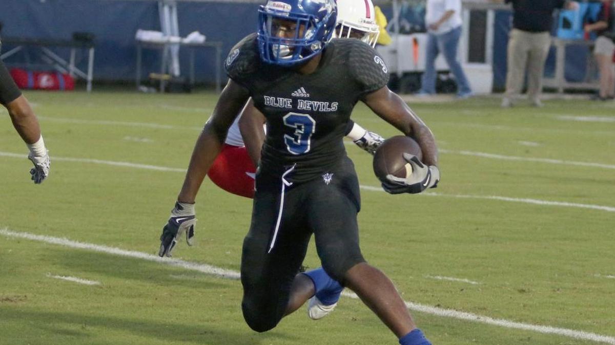 Pearl River Central’s Diante Lenior carries the ball for positive yardage during Friday’s matchup against Harrison Central.