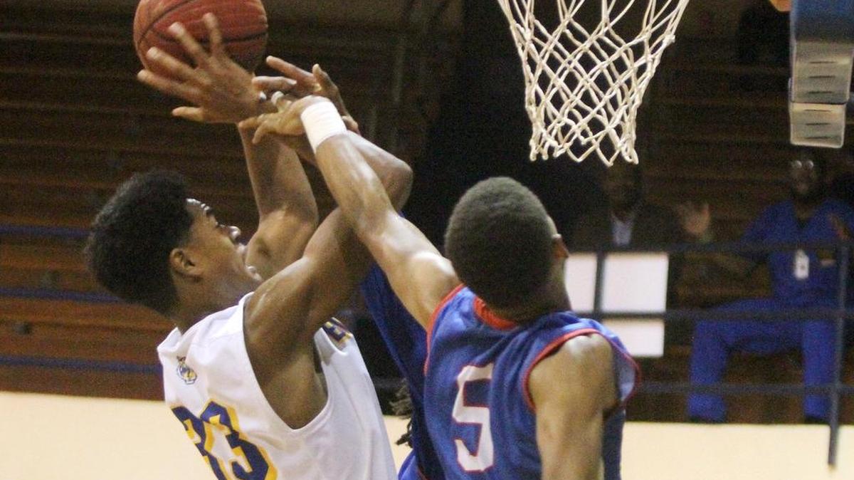 Bay's Galen Smith III is fouled by Pascagoula's Zarin Cole during the second quarter of their game at Bay High on Tuesday, Nov. 15, 2016.