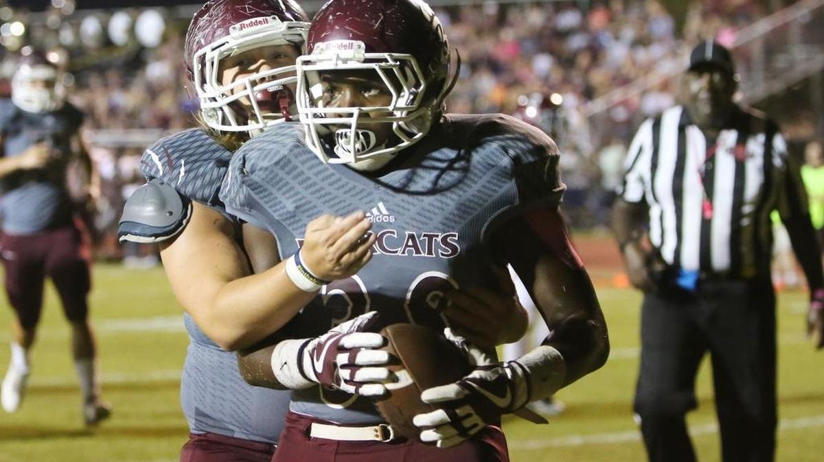 Long Beach running back Dennis Andrews and lineman Caleb Gowens celebrate a touchdown against Picayune at Lumpkin-Magee Stadium in Long Beach on Oct. 13.