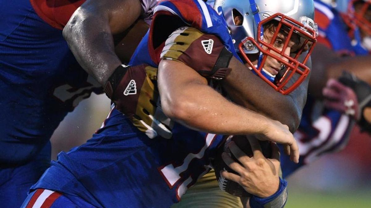 George County defensive lineman McKinnley Jackson (44) wraps up Pascagoula quarterback Hunter Collins (15) on Sept. 9 in Pascagoula, Miss.