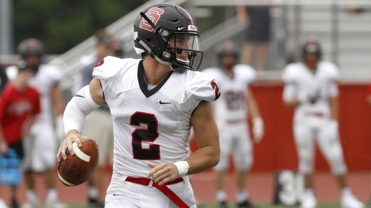 St. Stanislaus quarterback Jake Greer looks for an open receiver at the Shrimp Bowl Saturday afternoon, Aug. 19, 2017.