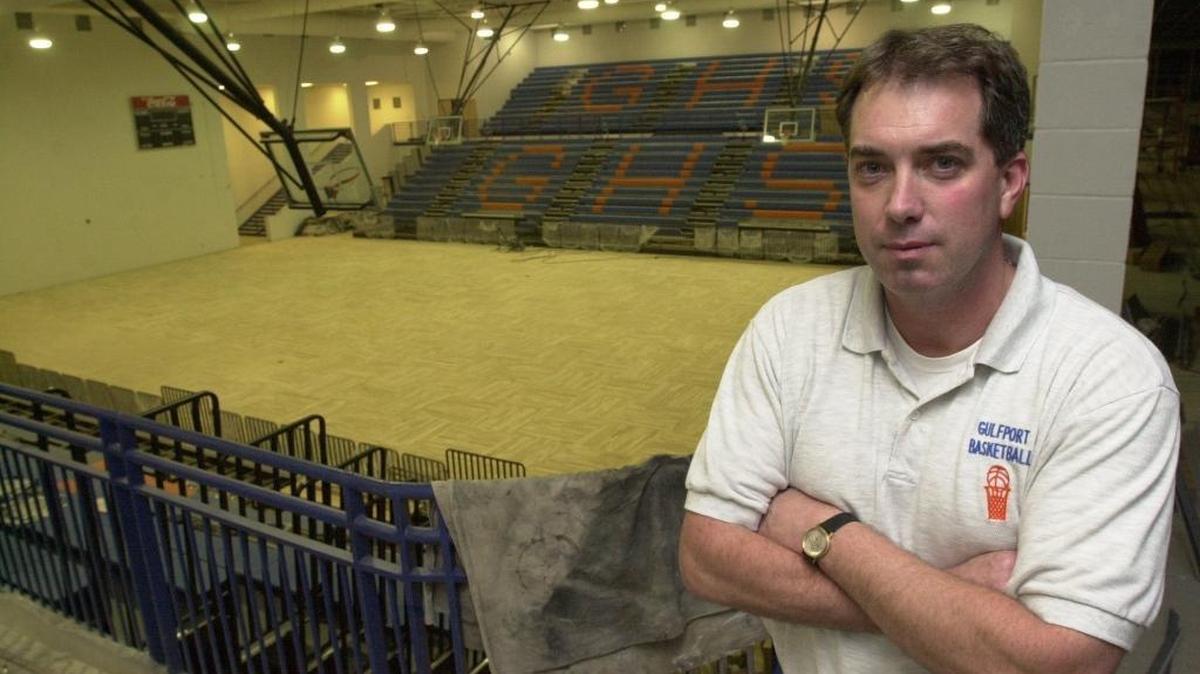 Gulfport High School head coach Bryan Caldwell poses inside Bert Jenkins Gymnasium just prior to its completion.