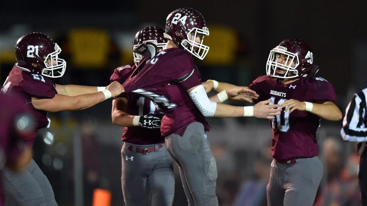 East Central middle linebacker Avery White (24) celebrates with teammates after returning an interception for a touchdown against West Lauderdale on Nov. 10, 2017, in Hurley.