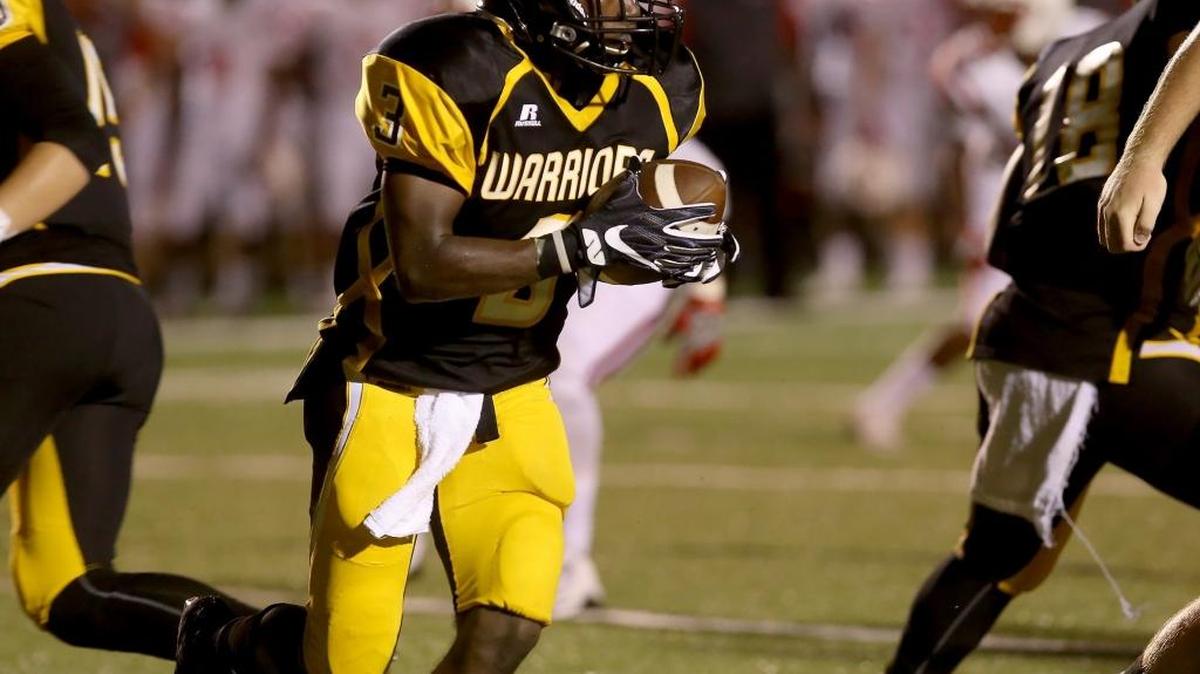 D'Iberville's Ja'Quavis Foster runs the ball against Biloxi on Friday, September 23, 2016, at Warrior Stadium.