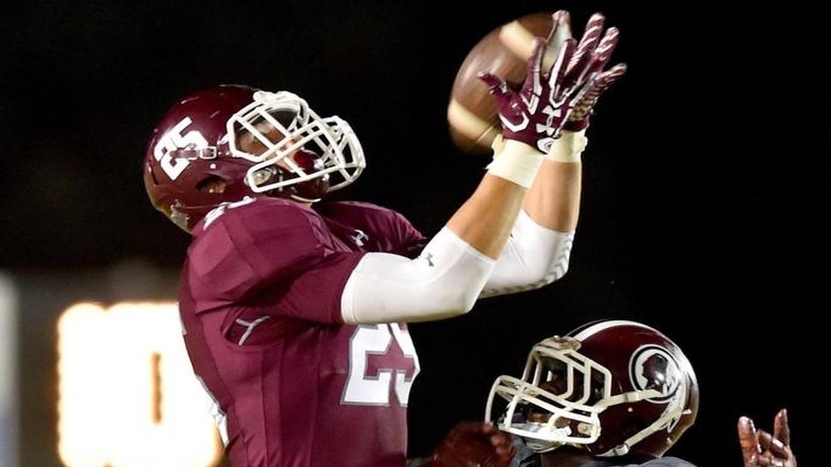 East Central's Brad Cumbest (25) catches a pass against Hazlehurst cornerback Julius Brown (8) during the second quarter, Friday, Sept. 15, 2017, at East Central High School in Hurley, Miss.