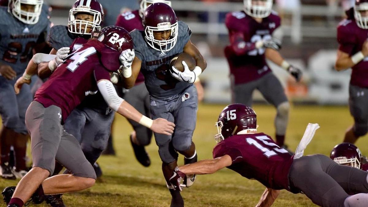 Hazlehurst running back Jahem James (9) carries the ball against East Central middle linebacker Avery White (24) and free safety Hunter Zwick (15) during the first quarter, Friday, Sept. 15, 2017, at East Central High School in Hurley. White is among South Mississippi’s tackle leaders through five weeks in the season.