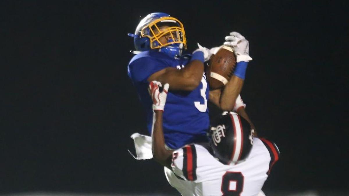 Resurrection's Patrick Lee catches a long pass despite pressure from Lumberton's Jayson Buckleyon. The Eagles travel to Nanih Waiya for the 1A South state title game on Friday night.