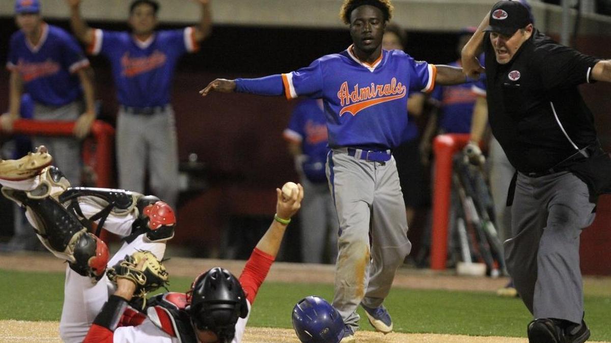 Gulfport's Larazzo Shugart watches as the umpire calls him out following a tag by Biloxi catcher Tucker Thomas during the third inning of their game at Biloxi on Tuesday, March 28, 2017.