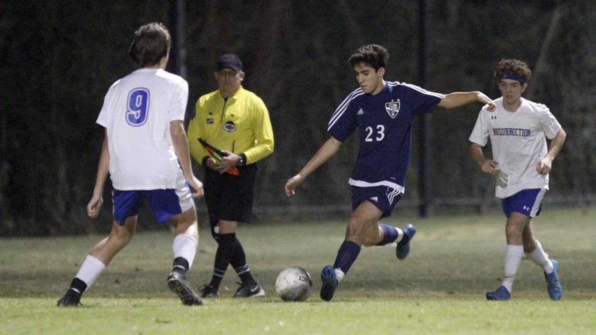 St. Patrick's Ricardo Quintana dribbles the ball against Resurrection's Andrew Holland. Quintana scored one of St. Patrick’s goals in Tuesday’s Class 1A/2A/3A South State Championship win over Sacred Heart.